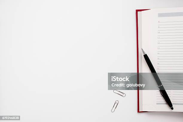 Blank Notebook With Pen And Clips Free Space Stock Photo - Download Image Now - Meeting, White Background, Desk
