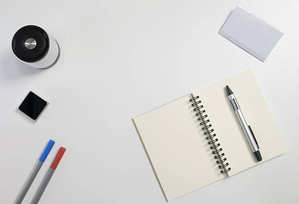 istock Office desk with sound speaker, ball pen, notebook. 619247638