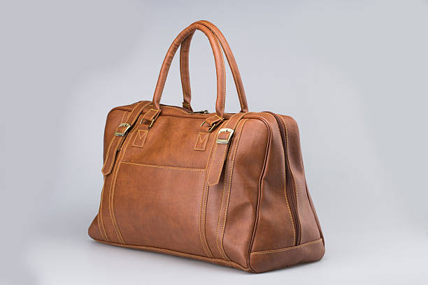 istock Brown Leather Woman Bag On White 619248938