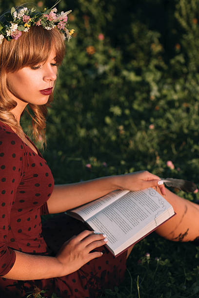 istock Beautiful blonde with book profile, copy space 619249814