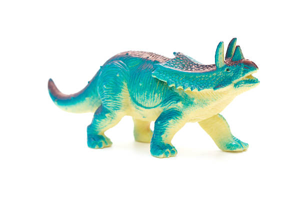 istock side view blue  Pentaceratops toy on a white background 619250040