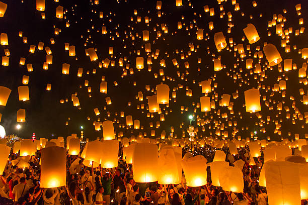 hot-air balloons Sky lanterns with fireworks, flying lanterns, floating lanterns, hot-air balloons , Loy Krathong (Yi Peng) Festival in Chiang Mai Thailand monk religious occupation photos stock pictures, royalty-free photos & images