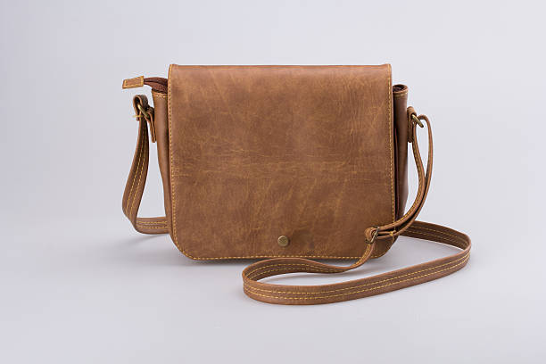 istock Brown Leather Woman Bag On White 619250862