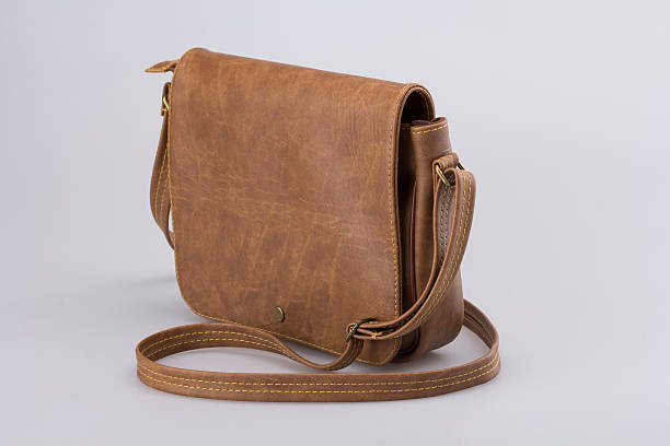istock Brown Leather Woman Bag On White 619250948