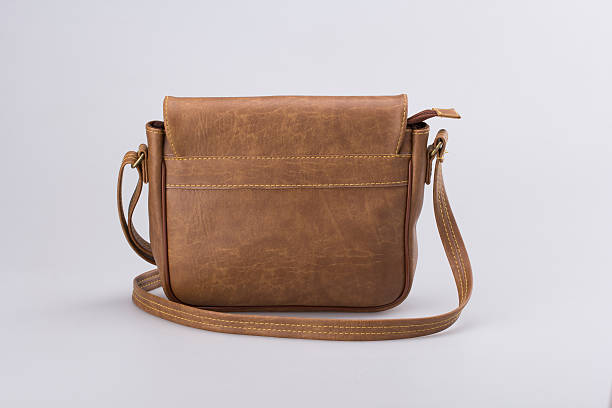 istock Brown Leather Woman Bag On White 619251048