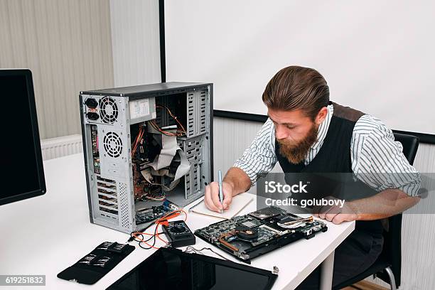 Programmer Inventorying Of Electronic Equipment Stock Photo - Download Image Now - Desktop PC, Model Kit, Computer