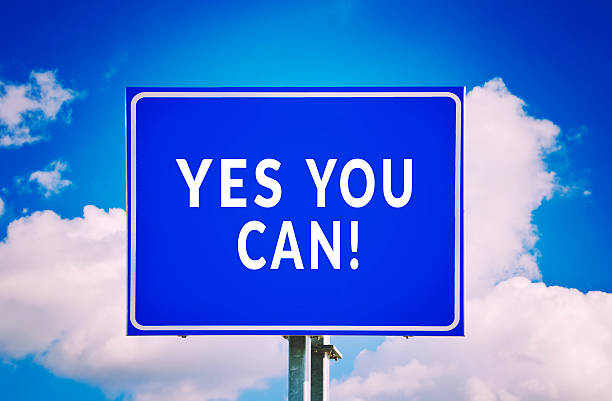 istock Yes You Can! road sign with cloud background 619251898