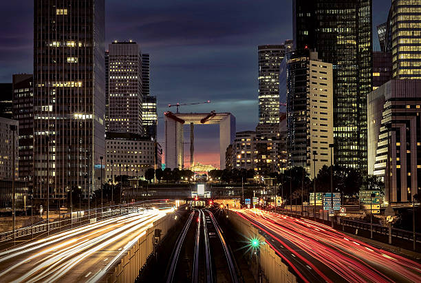 istock Modern city at night with cars light lines. 619252450