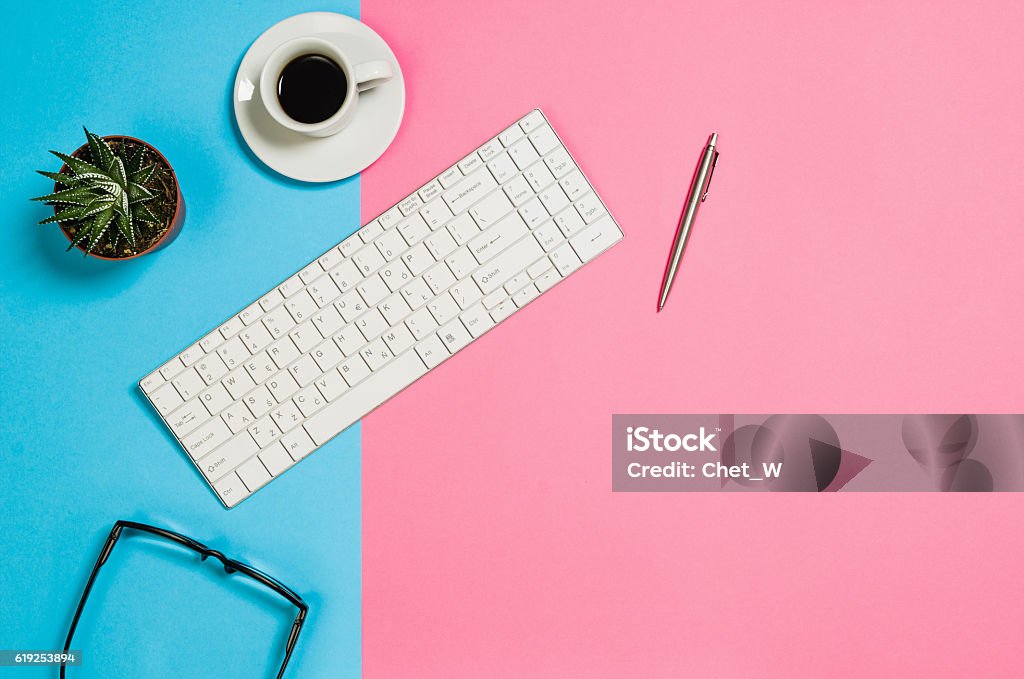 Flat lay photo of a creative freelancer woman workspace desk Flat lay photo of a creative freelancer woman workspace desk with copy space background. Image taken from above, top view. Minimal style with colorful paper backdrop Backgrounds Stock Photo