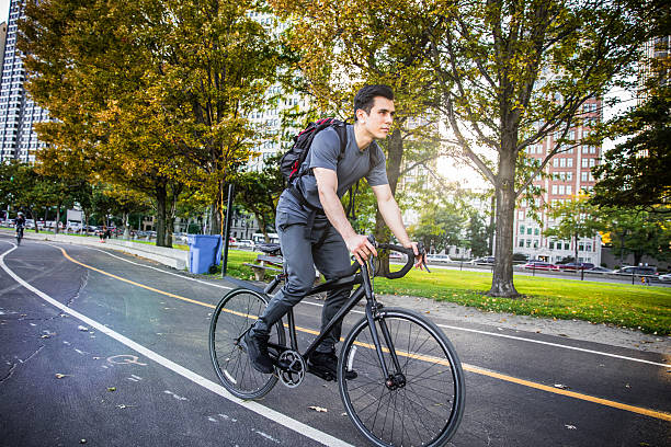 istock Young man cycling in the city, commuting to work 619254724