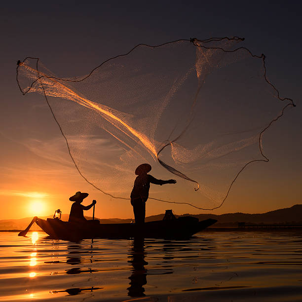 istock Fisherman Thailand on the river and sunrise . 619255630