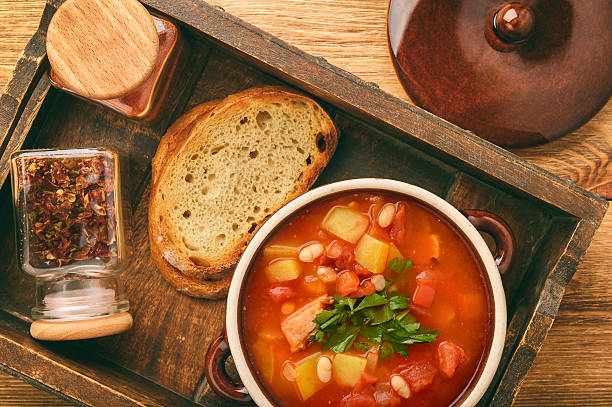 istock Hot bean soup with bacon and vegetables. 619257178