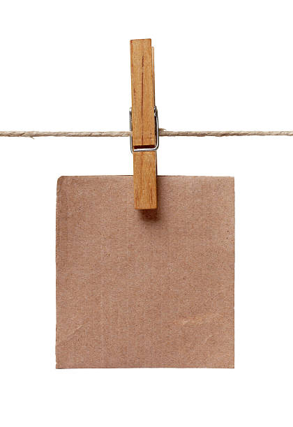 istock clothes peg and note paper on clothes line rope 619257256
