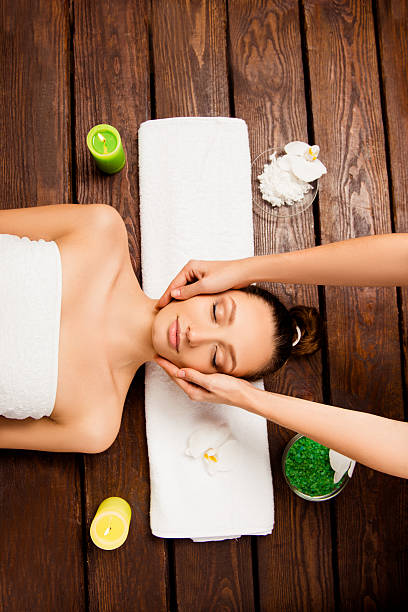 istock Top view of young woman relaxing and having spa procedures 619258062