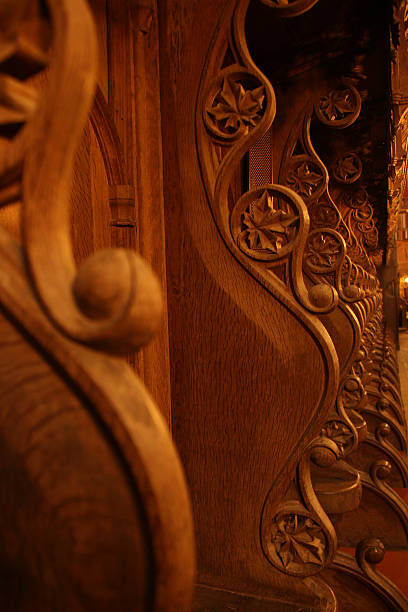 istock Beautiful empty Carved bench in an old gothic medieval church 619258622