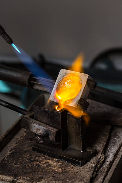 istock Silver Casting from Crucible to Metal Mold 619259186