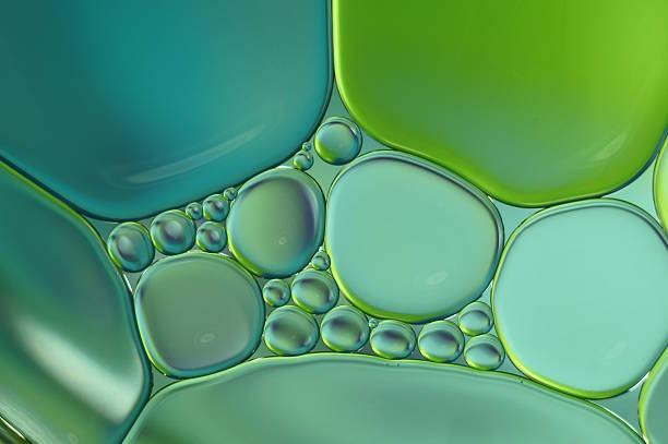 istock Oil drops on water surface - blue and green (412) 619259354