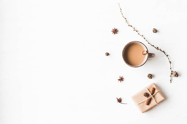 istock Cup of coffee, larch branches, cinnamon sticks, christmas gift 619262378