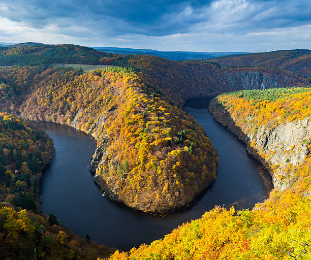 istock River canyon with dark water and autumn colorful forest 619262682