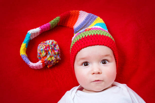 istock Baby in red and white hat 619262800