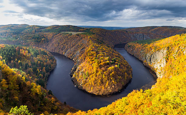 istock River canyon with dark water and autumn colorful forest 619262802