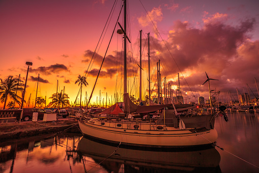 Beautiful panorama of sailing boats docked at the Ala Wai Harbor at sunset the largest yacht harbor of Hawaii, situated between Waikiki and downtown Honolulu in Oahu, Hawaii.
