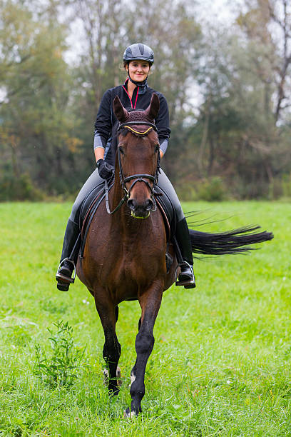 istock Young woman horseback 619267224