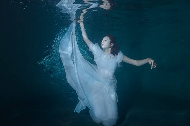 istock Woman on the ocean floor. 619268080