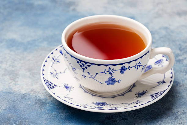 istock Cup of tea on a blue stone background. Copy space 619268284