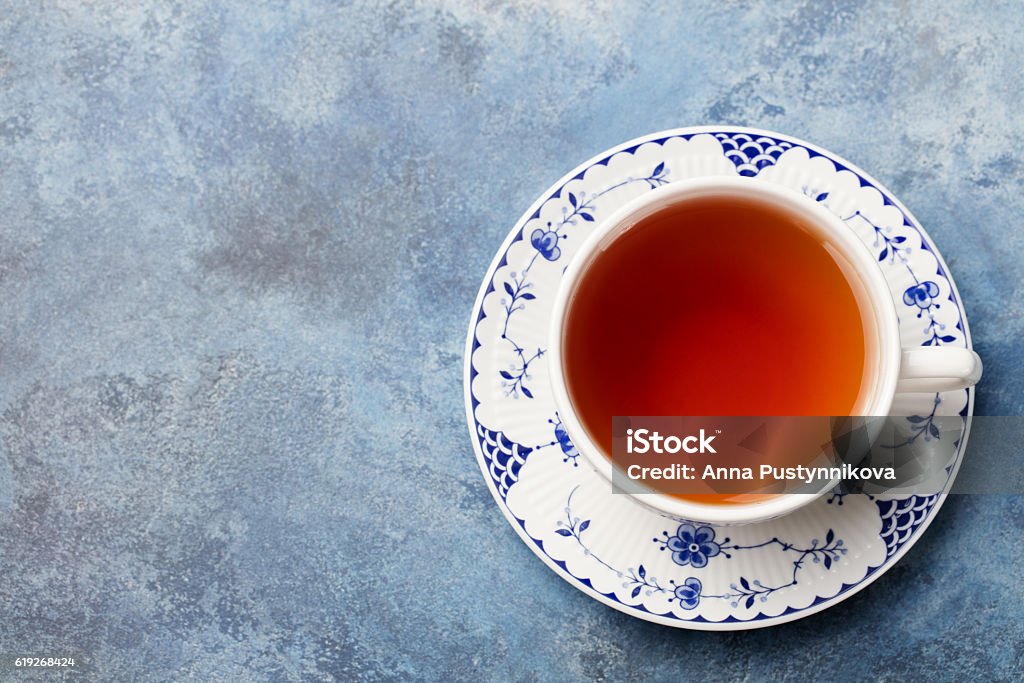 Cup of tea on a blue stone background. Top view Cup of tea on a blue stone background. Copy space Top view Tea - Hot Drink Stock Photo