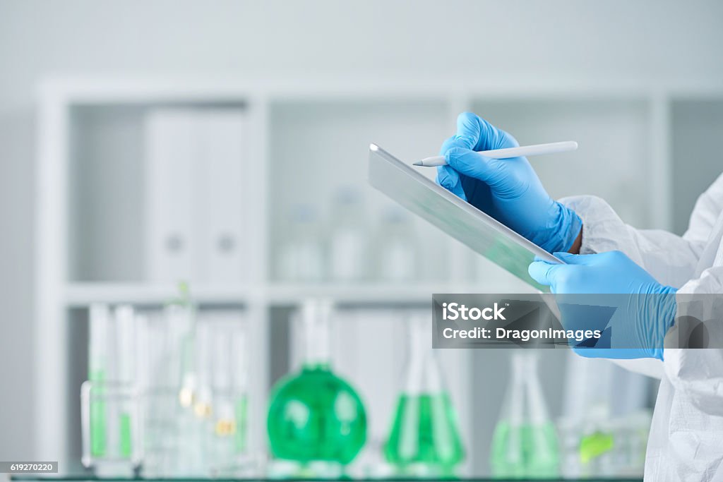 Taking Lab Notes Taking Notes On Experiment Stock Photo - Download Image Now ...