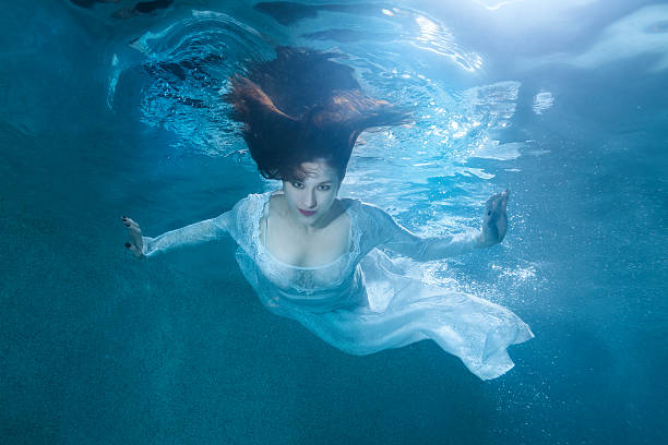 istock Fairy woman under water. 619270884