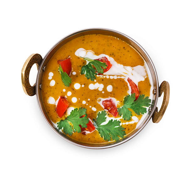 Vegan and vegetarian indian cuisine dish, spicy lentil dahl soup Vegan and vegetarian dish, spicy lentil dahl soup bowl. Indian cuisine, masala hot dal meal isolated on white background. Eastern local cuisine restaurant food top view curry powder stock pictures, royalty-free photos & images