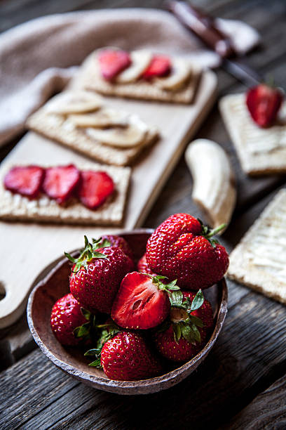 istock Fruity toast on wooden background. Strawberries 619271146
