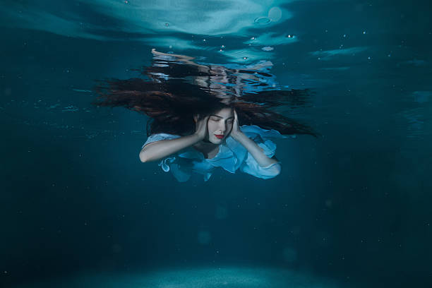 istock Woman with long hair underwater. 619271586