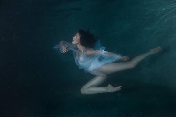 istock Woman under the water like a fairy tale. 619272140