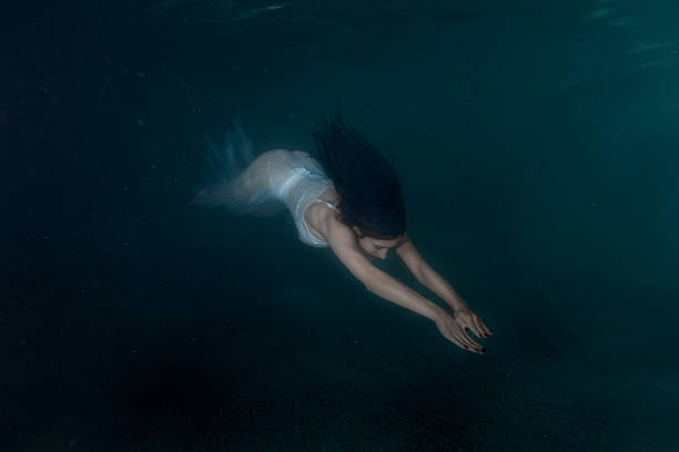 istock Woman mermaid under water. 619272652