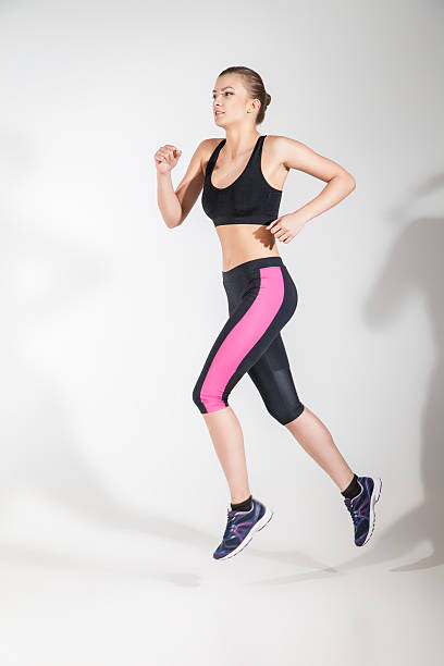 istock Young beautiful woman  running 619272932