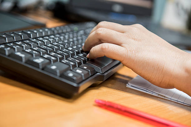 istock working at the office, typing on computer, business concept 619273016