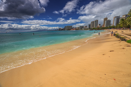 Waikiki ,Oahu, Hawaii, United States - August 27, 2016: Waikiki Beach skyline from San Souci Beach. San Souci Beach is it off the Waikiki hotel strip and is a haven for swimmers, kayakers and surfers.