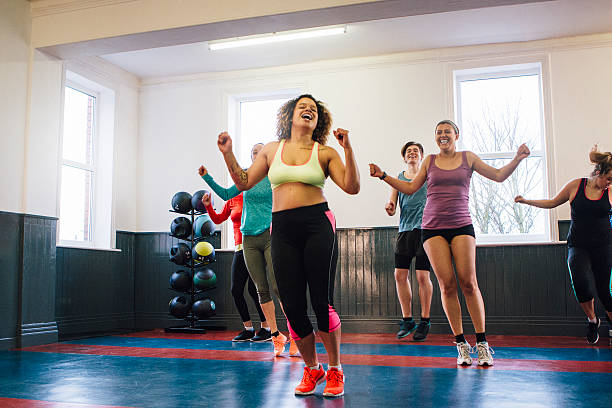 istock Group of People Enjoying an Exercise Class 619366650