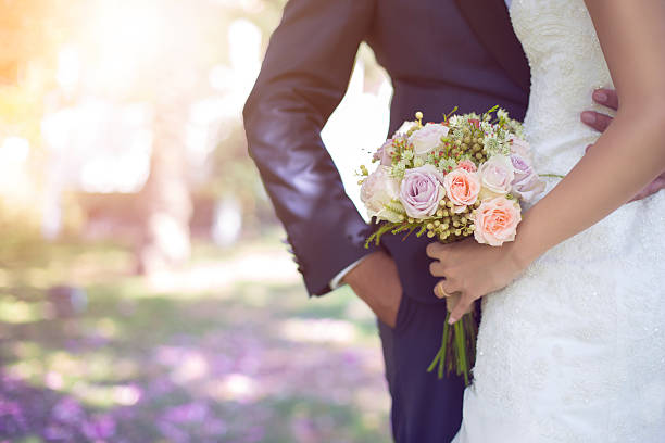 bride and bouquet Stock İmage Bride holding bouquet. honeymoon stock pictures, royalty-free photos & images