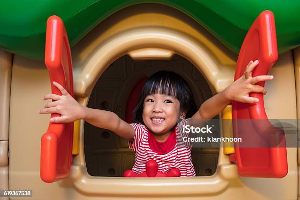 Asian Chinese Little Girl Playing In Toy House Stock Photo - Download Image Now - Child, Playground, Preschool