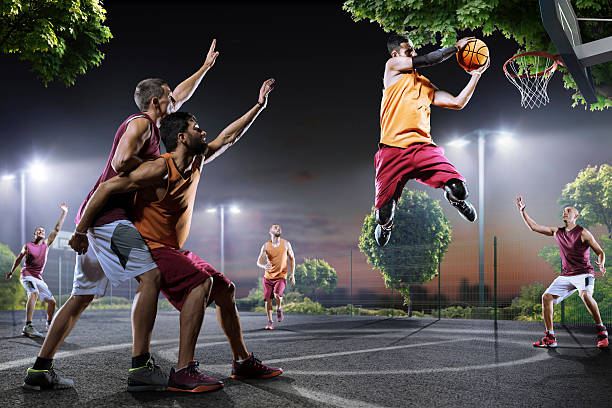 istock Basketball players in action on court 619368302