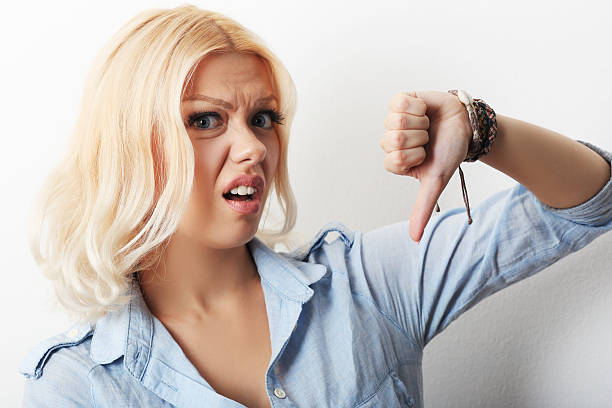 girl showing thumb down