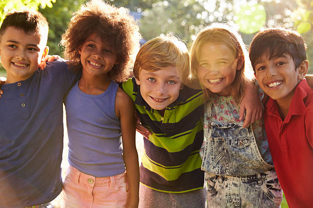 istock Portrait Of Five Children Having Fun Outdoors Together 619371214