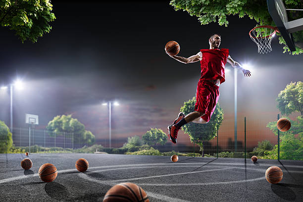 istock Basketball player is working out on night court 619371602