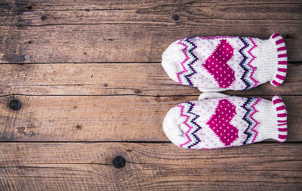 istock wooden background Classic gloves with cap 619371854