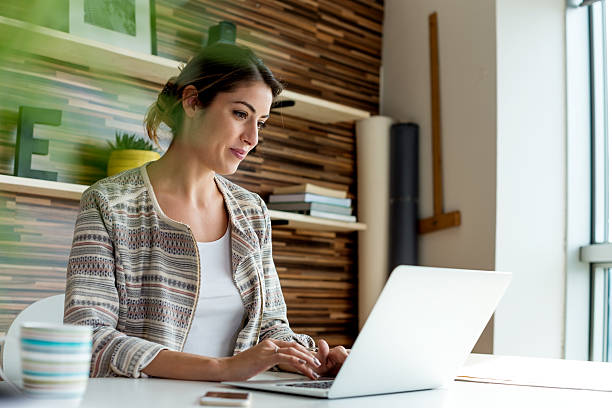 istock Young Woman Working at her office 619371940