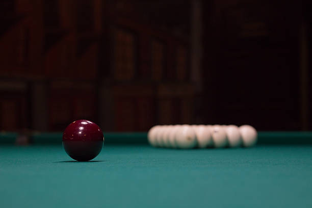 istock Russian billiards, red and white balls on green table cloth 619373654